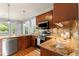 Well-equipped kitchen featuring granite countertops and stainless steel appliances at 84 N Hadrian Ct, Clayton, NC 27520