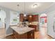 Kitchen featuring stainless steel appliances, granite counters, and hardwood floors at 84 N Hadrian Ct, Clayton, NC 27520