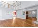 Spacious living room with hardwood floors, an open floor plan, and lots of natural light at 84 N Hadrian Ct, Clayton, NC 27520