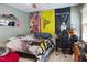 Teenage bedroom with decorative flags, wall decor and a dedicated gaming area at 8401 Hobhouse Cir, Raleigh, NC 27615