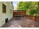 Spacious wooden deck with outdoor dining table overlooking the lush surrounding greenery at 8401 Hobhouse Cir, Raleigh, NC 27615