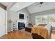 Cozy living room with a fireplace, hardwood floors, neutral walls and comfortable seating at 8401 Hobhouse Cir, Raleigh, NC 27615