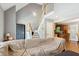 Open living room with a staircase, wood floors, neutral walls, and seamless flow to kitchen at 8401 Hobhouse Cir, Raleigh, NC 27615