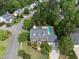 Aerial shot of a home with a swimming pool, well-kept landscaping, and mature trees at 101 Conway Ct, Cary, NC 27513