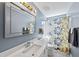 Upgraded bathroom featuring a large mirror with vanity lighting and floral shower curtain at 101 Conway Ct, Cary, NC 27513