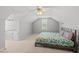 Bedroom featuring a ceiling fan and a bed with floral-patterned bedding at 101 Conway Ct, Cary, NC 27513