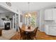 Cozy dining area with hardwood floors and a round wooden table, ideal for Gathering meals and gatherings at 101 Conway Ct, Cary, NC 27513