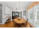 Bright dining area with a round wooden table and a view into the living room, perfect for Gathering meals at 101 Conway Ct, Cary, NC 27513