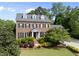 Beautifully landscaped brick home featuring black shutters and a welcoming front entrance at 101 Conway Ct, Cary, NC 27513