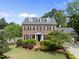 Charming two-story brick home with dormers and a beautifully landscaped front yard at 101 Conway Ct, Cary, NC 27513