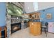 The sunroom provides a stone fireplace, skylights, and a wet bar area at 101 Conway Ct, Cary, NC 27513