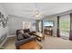 Inviting living room featuring a comfortable sofa, a ceiling fan, and a wall-mounted TV, creating a relaxing atmosphere at 101 Conway Ct, Cary, NC 27513