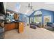 Living room with a wet bar, skylights, high ceilings and blue walls at 101 Conway Ct, Cary, NC 27513