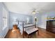 Inviting main bedroom with hardwood floors, soft lighting, and a spacious layout, creating a cozy retreat at 101 Conway Ct, Cary, NC 27513