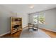 Office features hardwood floors, a bright window, and shelving unit at 101 Conway Ct, Cary, NC 27513