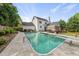 A stunning backyard featuring an in-ground pool, poolside seating, and a well-maintained lawn perfect for outdoor living at 101 Conway Ct, Cary, NC 27513