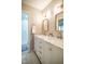 Bathroom featuring double vanity, marble countertops, framed mirrors and a walk-in shower at 101 Lakeshore Dr. Dr, Durham, NC 27713