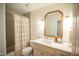 Bathroom featuring a white vanity with marble countertops, a large mirror, and a tub with shower at 101 Lakeshore Dr. Dr, Durham, NC 27713