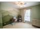 Green bedroom featuring a desk, sewing machine, shelving unit and a chest of drawers at 101 Lakeshore Dr. Dr, Durham, NC 27713
