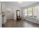 Open-concept living room features hardwood floors and lots of natural light at 1021 S Fieldhaven Dr, Fuquay Varina, NC 27526