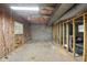 Unfinished basement area with concrete floor, exposed pipes, and wood framing at 104 Farnham Ct, Garner, NC 27529