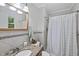 Charming bathroom featuring granite countertops and tiled backsplash at 104 Farnham Ct, Garner, NC 27529