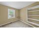 Bright bedroom with a large window and built-in shelving at 104 Farnham Ct, Garner, NC 27529