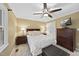 Comfortable bedroom featuring a ceiling fan, TV, and neutral decor at 104 Farnham Ct, Garner, NC 27529