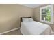 Cozy bedroom featuring natural light and neutral color scheme at 104 Farnham Ct, Garner, NC 27529