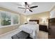 Comfortable bedroom featuring a ceiling fan, TV, and neutral decor at 104 Farnham Ct, Garner, NC 27529