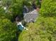 Beautiful aerial shot of a home featuring a pool, spa, and ample greenery, offering a private oasis at 108 Martinique Pl, Cary, NC 27511