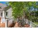 Relaxing back deck features an outdoor dining area with beautiful wooded backyard at 108 Martinique Pl, Cary, NC 27511