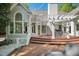 Backyard with a spacious deck, elegant pergola, and multiple access points to the home at 108 Martinique Pl, Cary, NC 27511