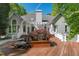 Large wooden deck featuring an ornate maple tree and a great view of the home's architecture at 108 Martinique Pl, Cary, NC 27511
