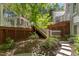 Multi-level deck with stairs and lattice details amidst lush landscaping at 108 Martinique Pl, Cary, NC 27511