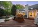 Expansive backyard with a pool, wooden deck, lush greenery, and ample space for outdoor enjoyment at 108 Martinique Pl, Cary, NC 27511