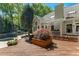 Expansive backyard deck with wooden planks, a cozy seating area, and a sparkling pool at 108 Martinique Pl, Cary, NC 27511