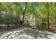 Scenic backyard view with an expansive lawn, patio, and beautiful landscaping at 108 Martinique Pl, Cary, NC 27511