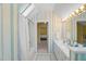 Bright bathroom featuring skylight, shower and tub combo and stylish fixtures and decor at 108 Martinique Pl, Cary, NC 27511