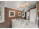 Stylish bathroom featuring a modern vanity, decorative lighting, and a large mirror with artwork at 108 Martinique Pl, Cary, NC 27511