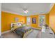 Cheery bedroom with hardwood floors, a patterned bedspread, and abundant natural light from the windows at 108 Martinique Pl, Cary, NC 27511