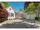 Charming home featuring a circular driveway and a three-car garage for ample parking and curb appeal at 108 Martinique Pl, Cary, NC 27511