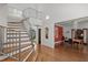Spacious foyer showcasing an open staircase and views into the dining and living spaces at 108 Martinique Pl, Cary, NC 27511