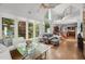 Bright living area with high ceilings, floor-to-ceiling windows, and an open floor plan to the kitchen at 108 Martinique Pl, Cary, NC 27511