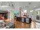 Spacious living area with hardwood floors, wet bar, and abundant natural light from multiple windows at 108 Martinique Pl, Cary, NC 27511