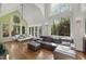 Bright living room with vaulted ceilings, large windows, and modern furniture at 108 Martinique Pl, Cary, NC 27511