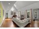Spacious living room with a fireplace, skylight, and hardwood floors at 108 Martinique Pl, Cary, NC 27511
