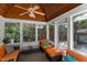 Bright sunroom with wood ceiling, ample windows, comfortable seating, and inviting decor at 108 Martinique Pl, Cary, NC 27511
