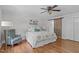 Serene bedroom with hardwood floors, soft natural light, and a decorative sliding barn door at 1107 Daleland Dr, Raleigh, NC 27612