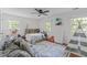 bedroom featuring neutral walls, ceiling fan, area rug, and natural light at 1107 Daleland Dr, Raleigh, NC 27612